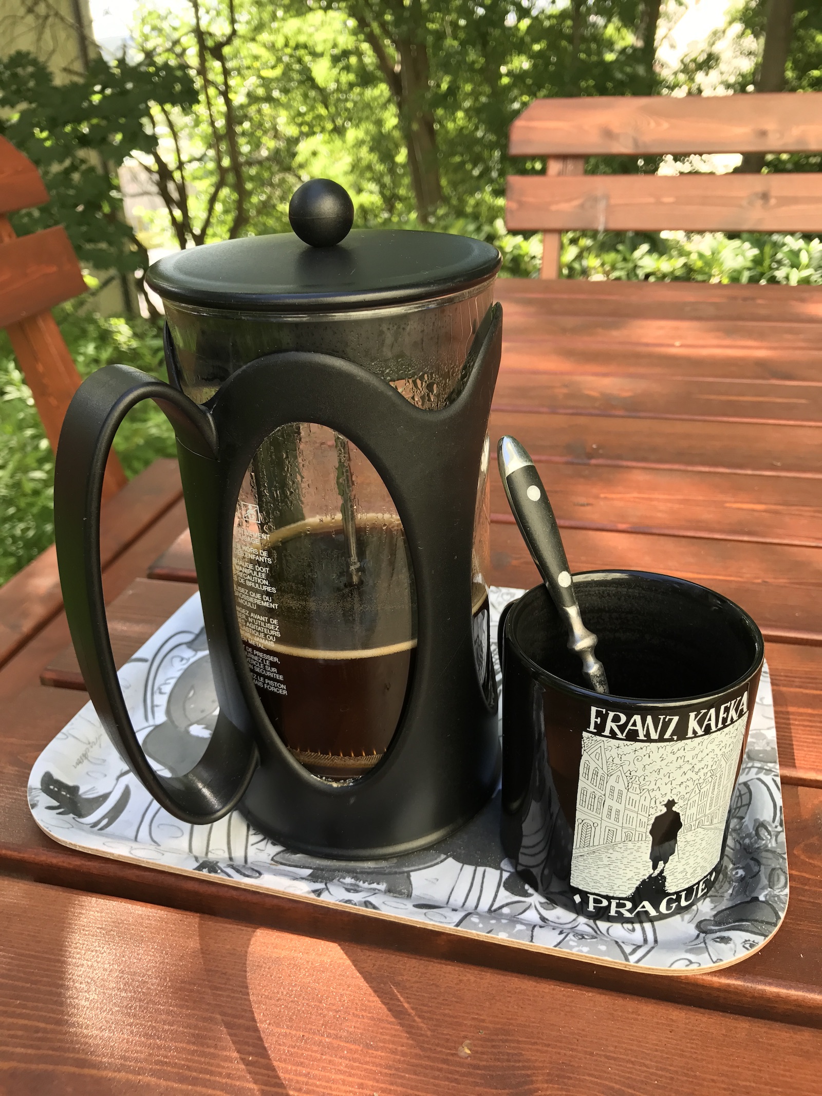Press of coffee in the garden